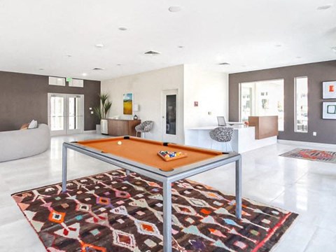 a pool table in the middle of a living room