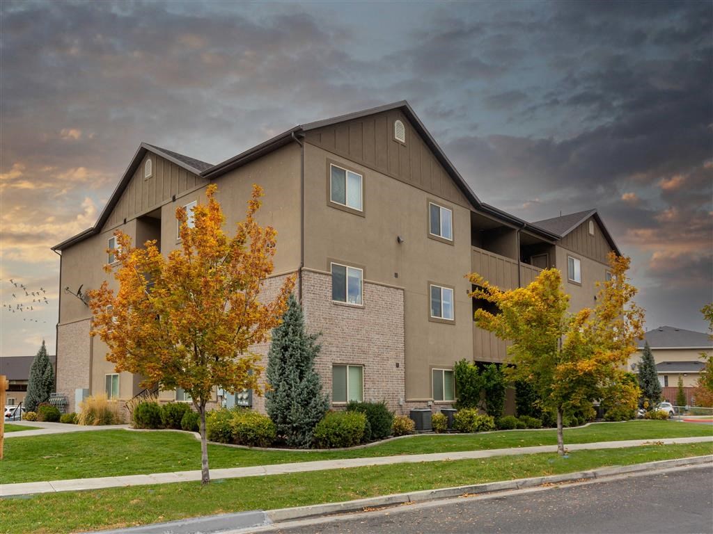 the view of a building with a cloudy sky in the background