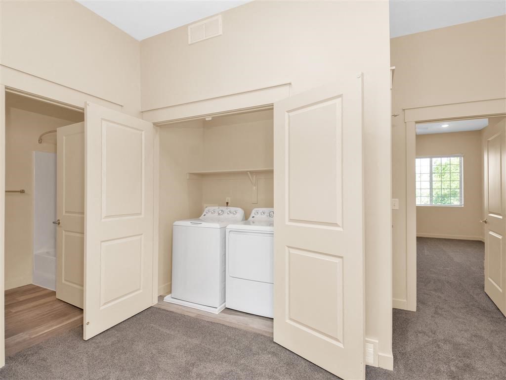 a room with a washer and dryer in it