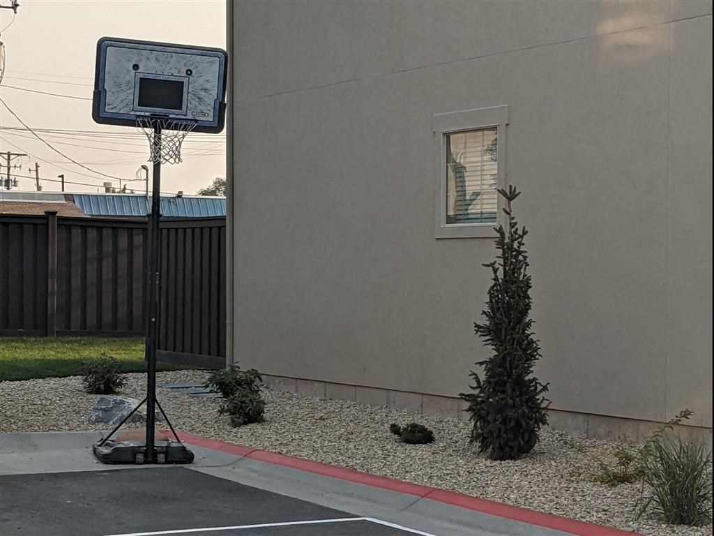 a basketball hoop on the side of a building