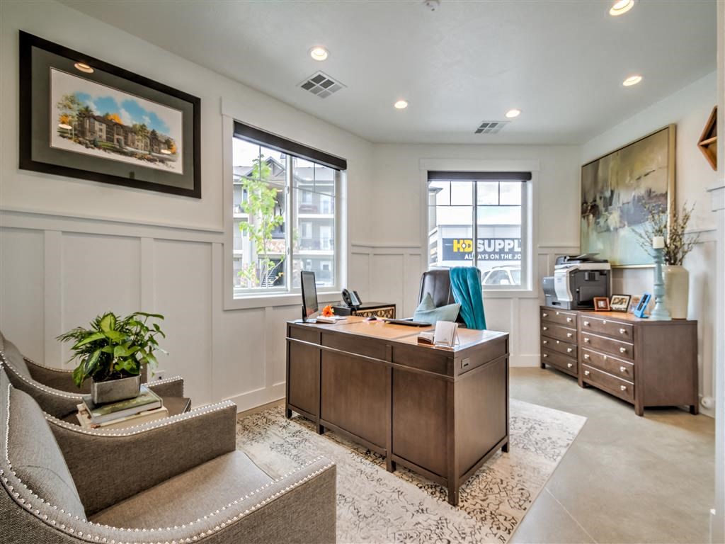 a home office with a desk and a chair at Aderra apartment complex in Roy, Utah