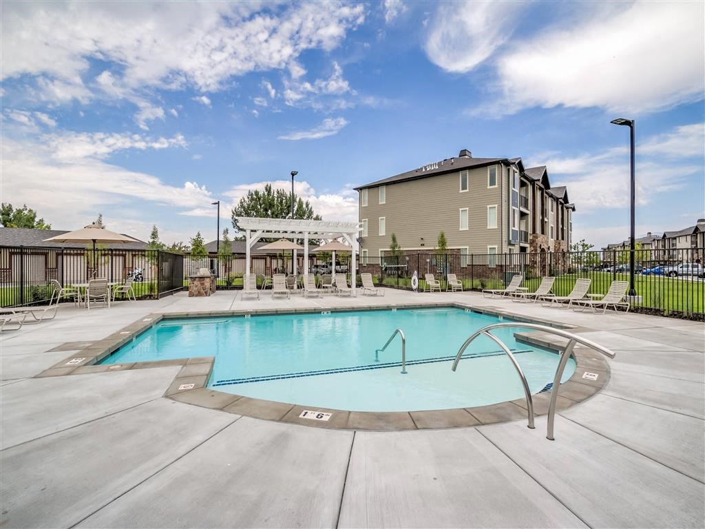 a swimming pool with a building in the background