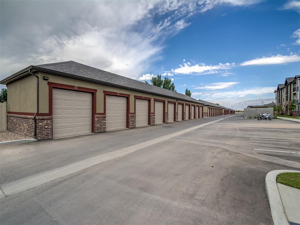 a long row of garage doors on the side of a building