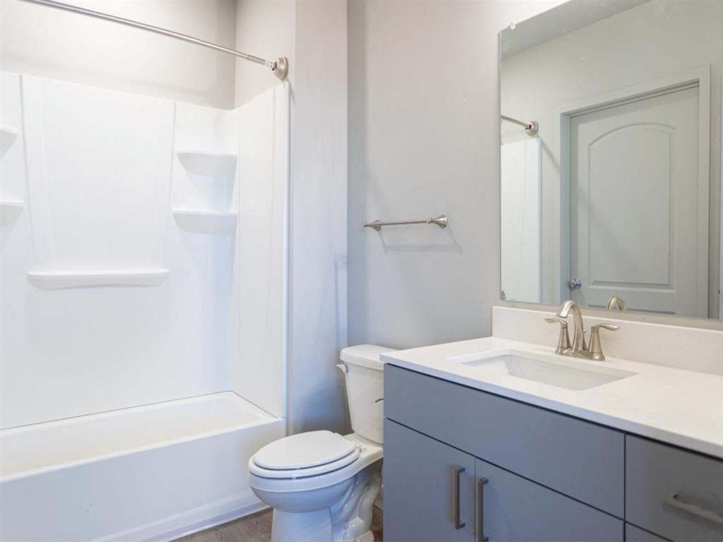 a bathroom with a sink toilet and a shower