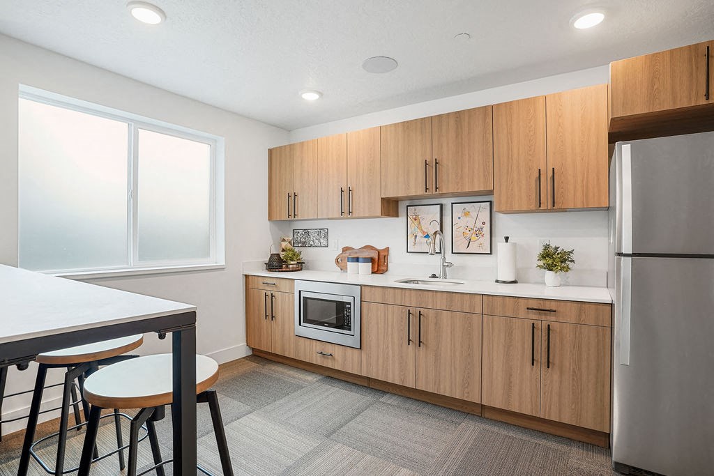 a kitchen with wooden cabinets and a counter top