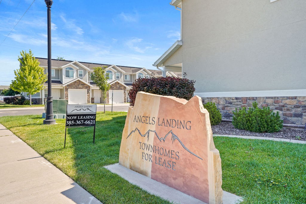 the building where the apartments are located has a sign for the leasing office