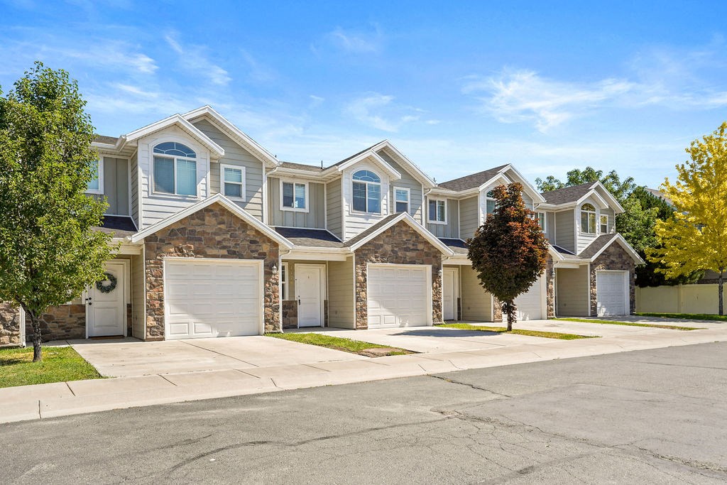 a rendering of a large house with a street in front of it
