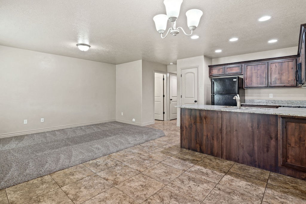 the vaulted ceiling of a synagogue with multicolored stained glass on the floor