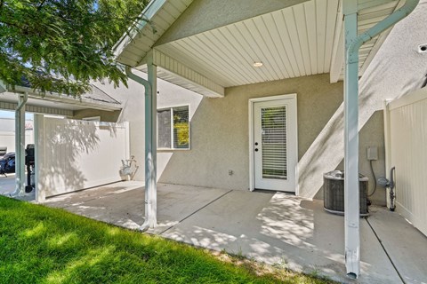 the front entrance of a house with a white door and a porch