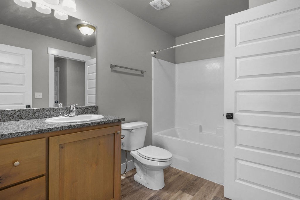 a bathroom with a toilet and a sink