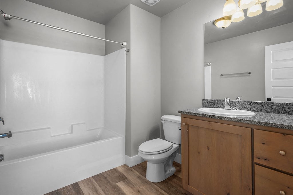 a bathroom with a sink toilet and a bath tub