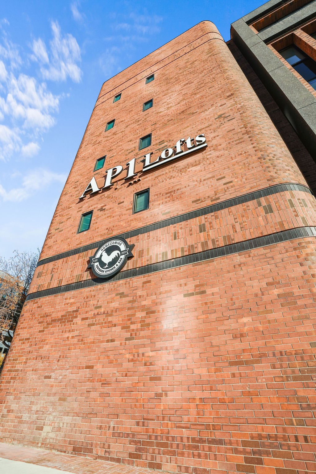 A tall brick building with the word