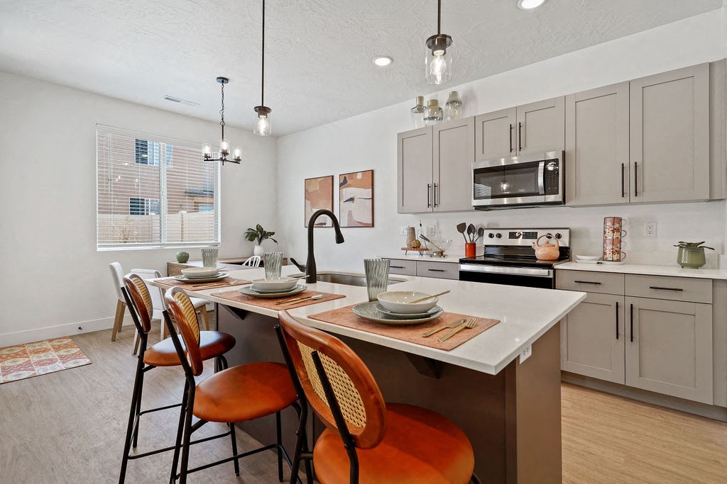 an open kitchen and dining area with a table and chairs