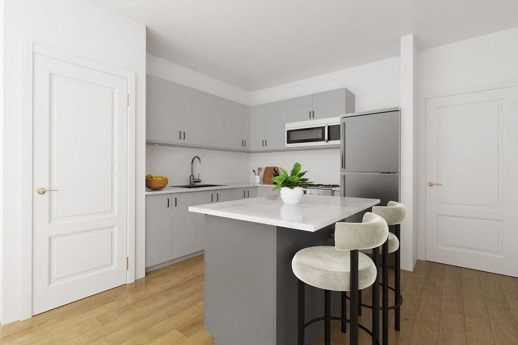 a digital rendition of a kitchen with an island at Valo on Vine townhomes in Toole, UT