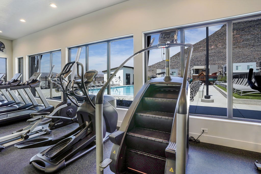 A gym with treadmills and a stair climber.