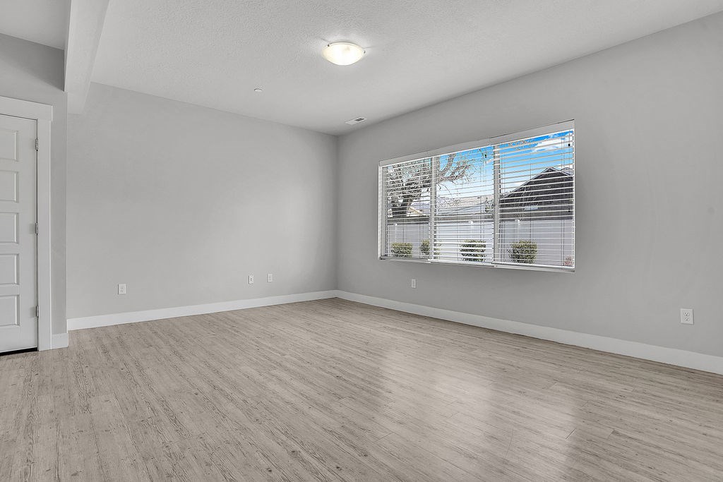 A room with a window and a door.