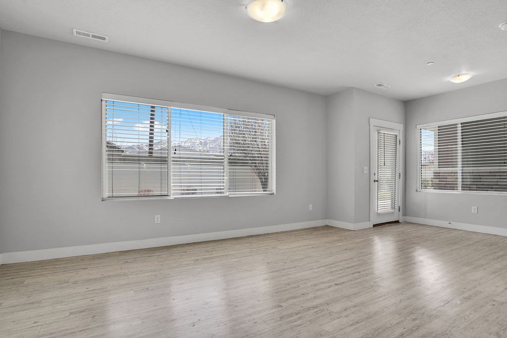 A room with a large window and a door.