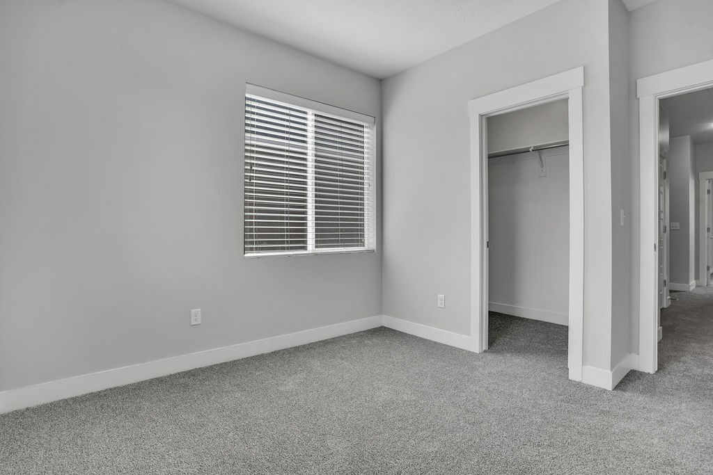 A room with a window and a door.