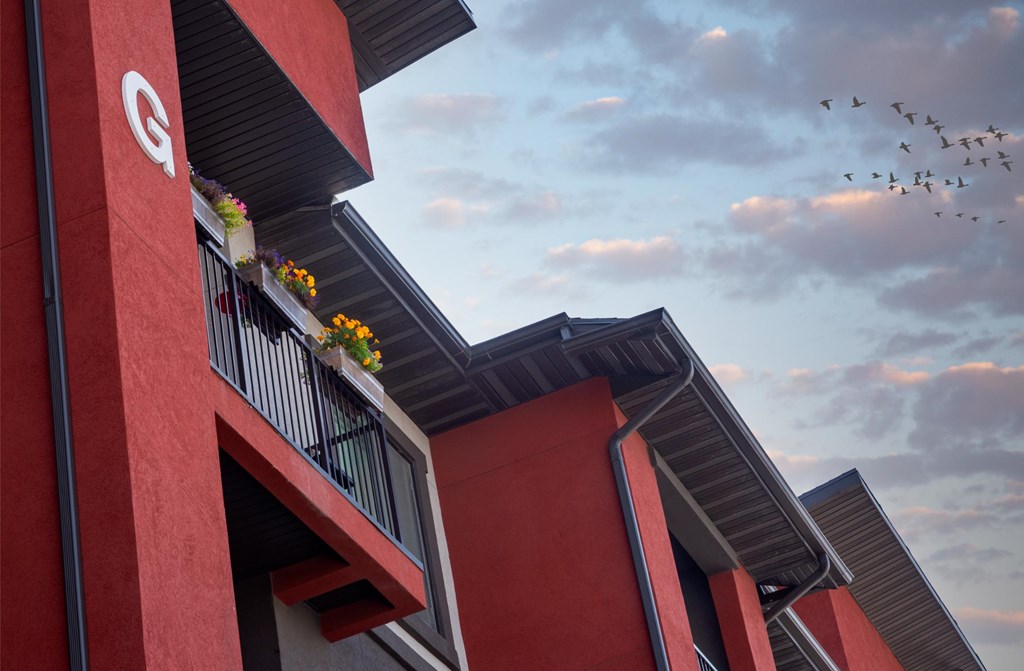 A red building with a white logo on it.