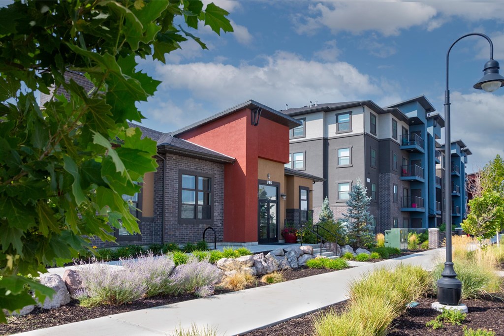 A modern apartment complex with a variety of colors on the buildings.