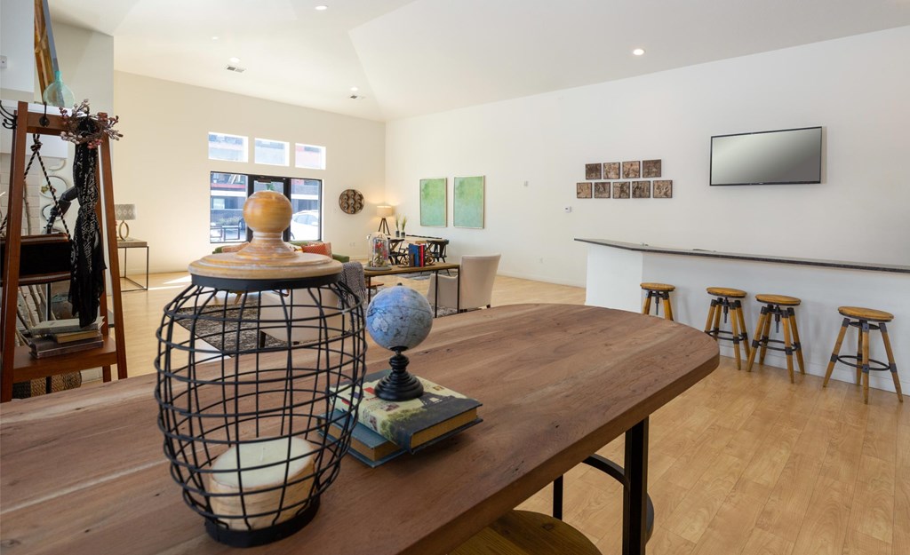 A room with a wooden table and a globe on it.