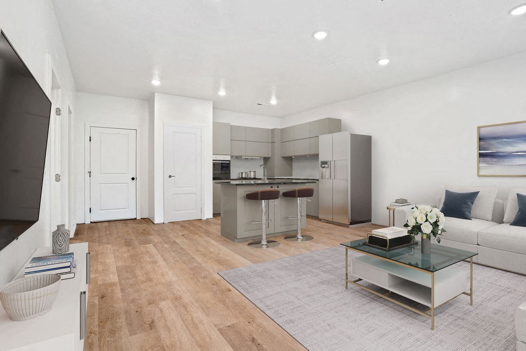 a living area with a kitchen and a couch