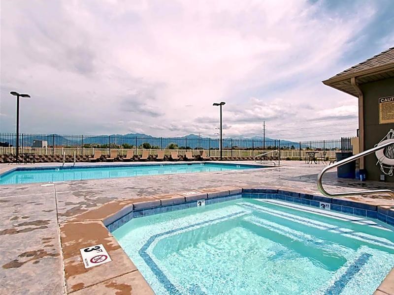 A pool with a mountain view in the background.