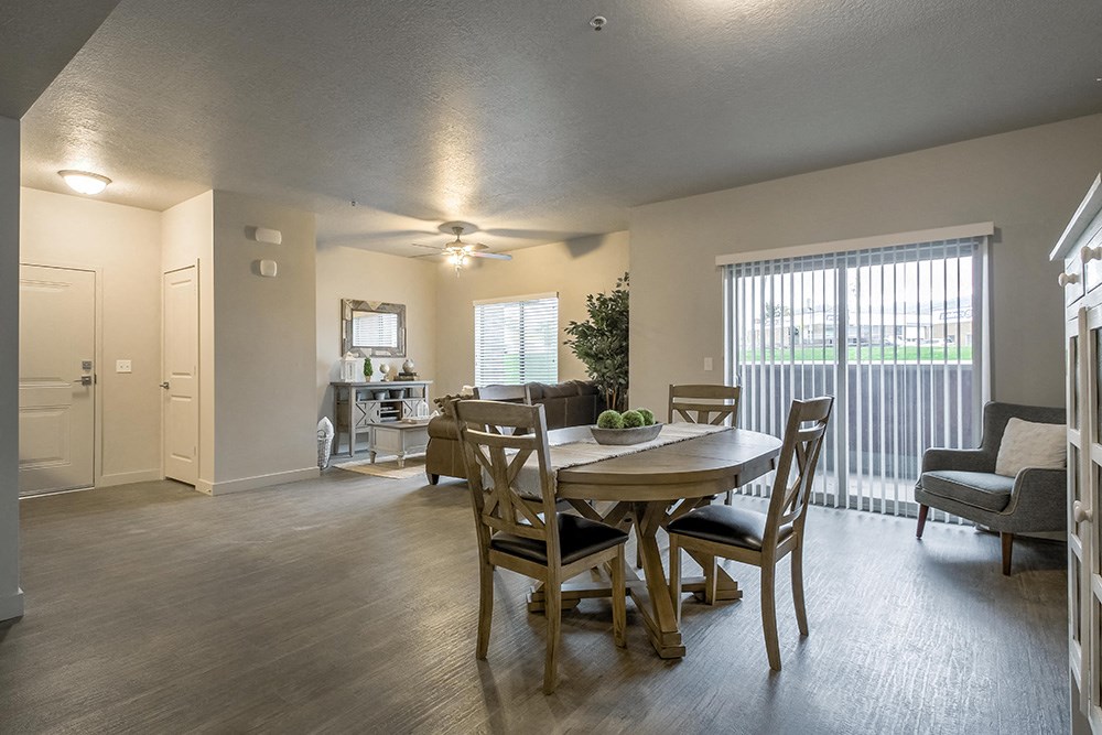 an open living room and dining room with a table and chairs