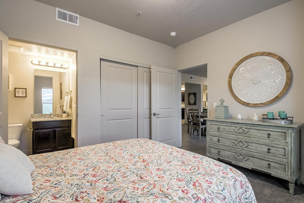 a bedroom with a bed and a dresser