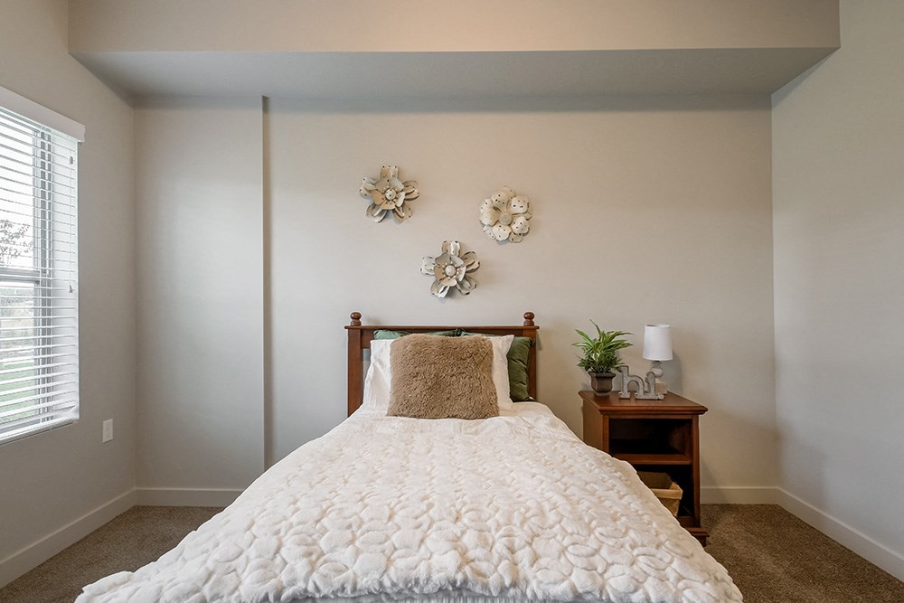 a bedroom with a bed and two night stands