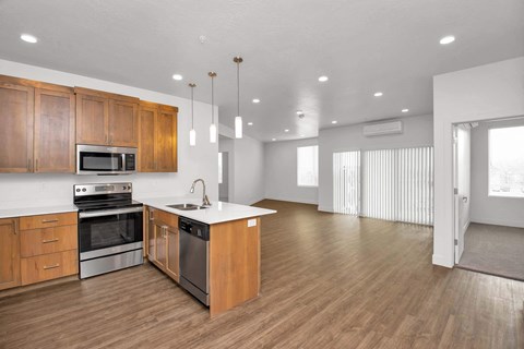 the kitchen and living room in a 555 waverly unit