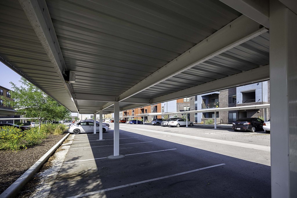 awning over a parking lot in front of a building