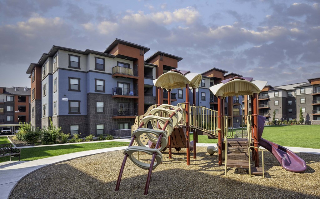 a playground at the flats at big tex apartments in san antonio, tx