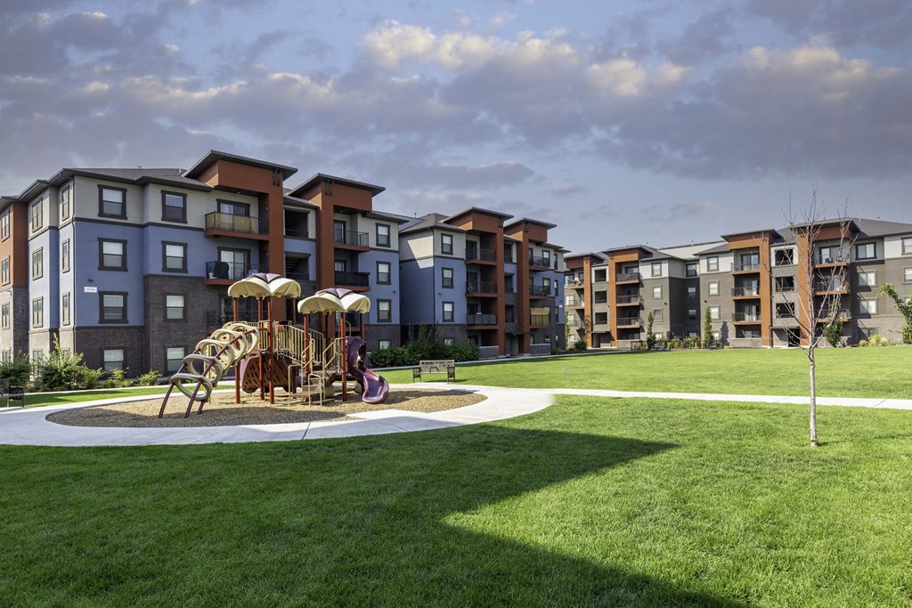 a playground at the flats at big tex apartments in san antonio, tx