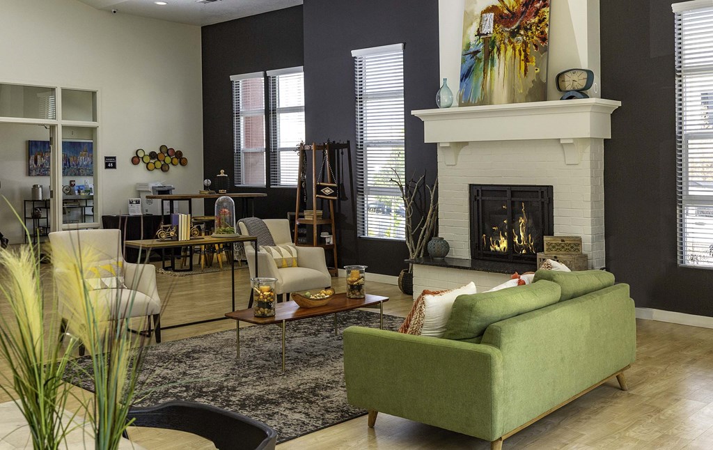 a living room filled with furniture and a fire place