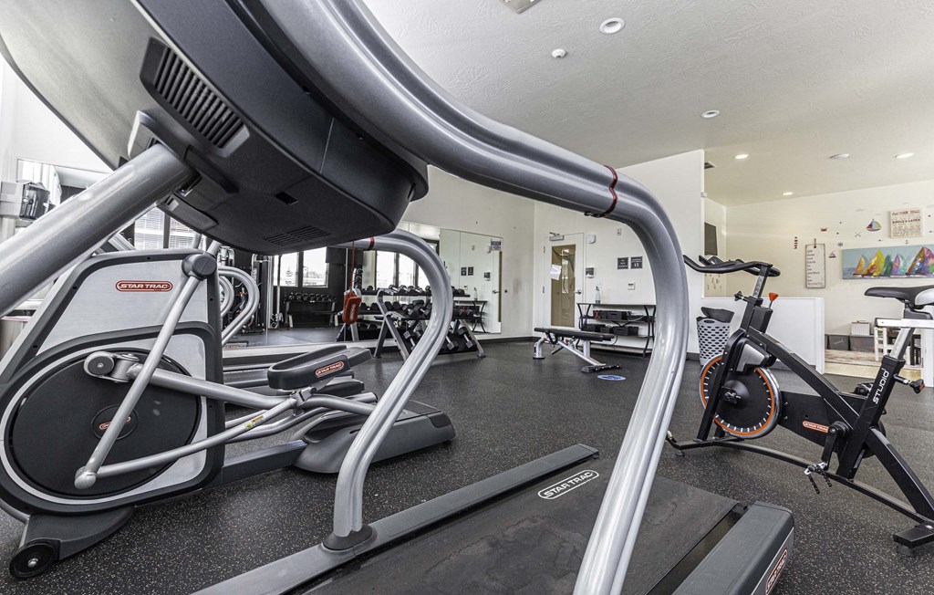 a room filled with lots of different types of exercise equipment