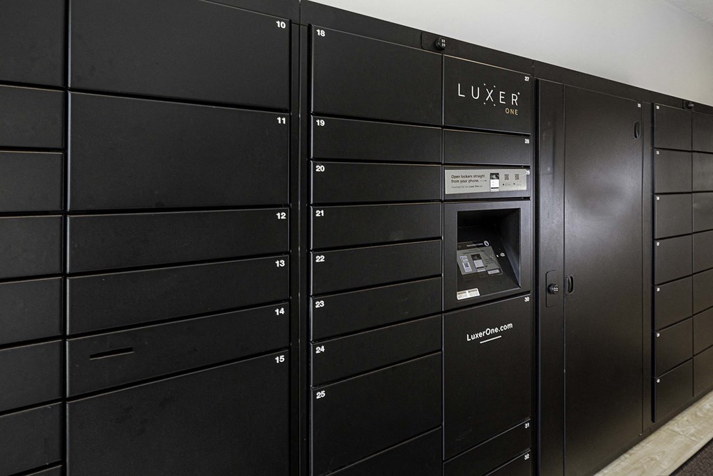 a row of lockers with an atm in the door