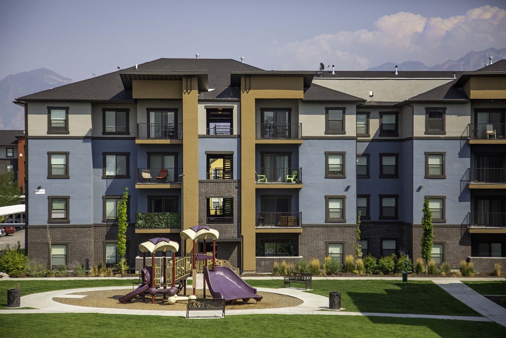 a playground at the flats at big tex apartments in san antonio, tx