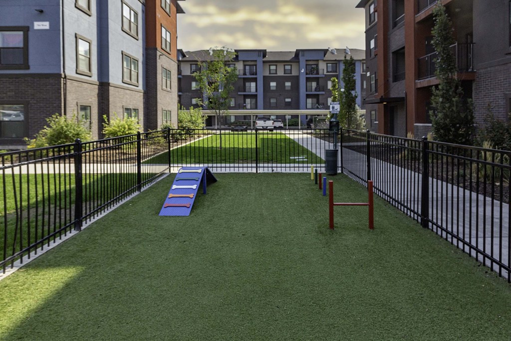 a rendering of a dog park in the middle of an apartment complex