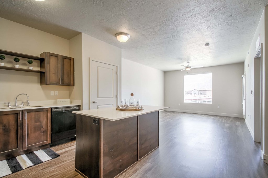 a kitchen and living room with a large window