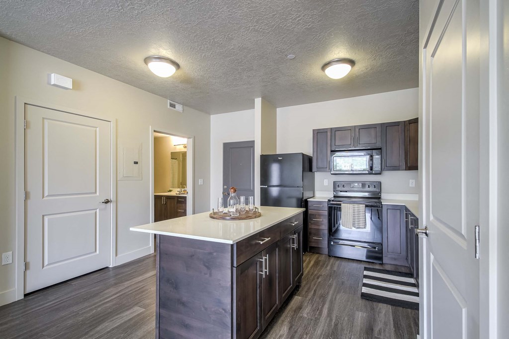 the kitchen in a bedroom plus den unit.