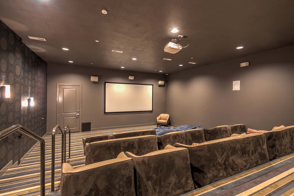 a large screening room with a projector screen