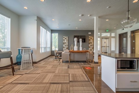 a living room and dining room with a table and chairs