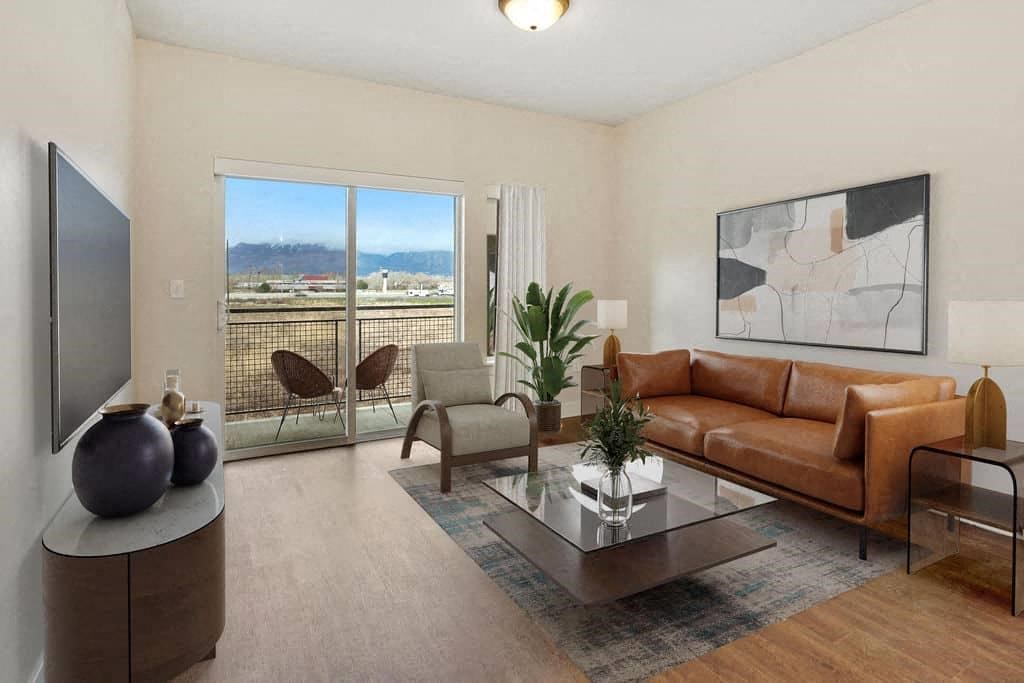 a living room with a leather couch and a coffee table