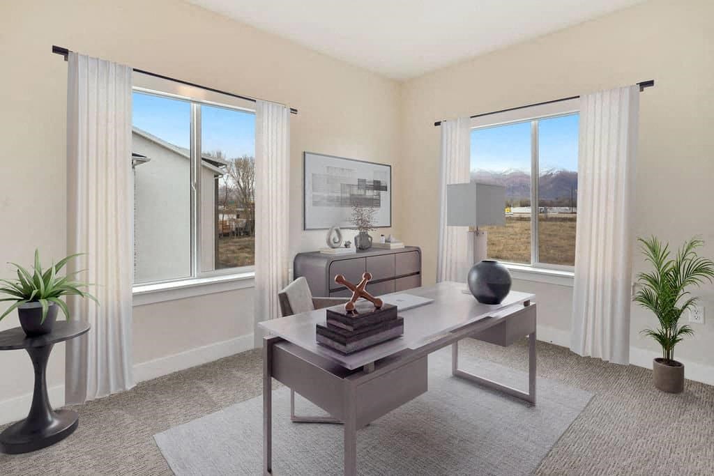 an office with a desk and a large window