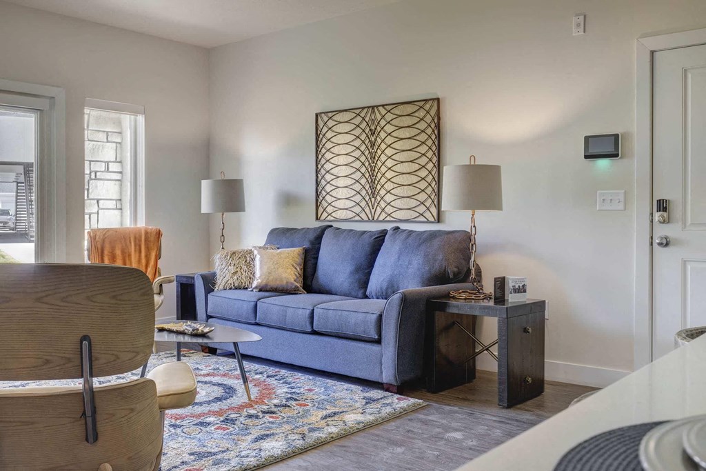 a living room with a blue couch
