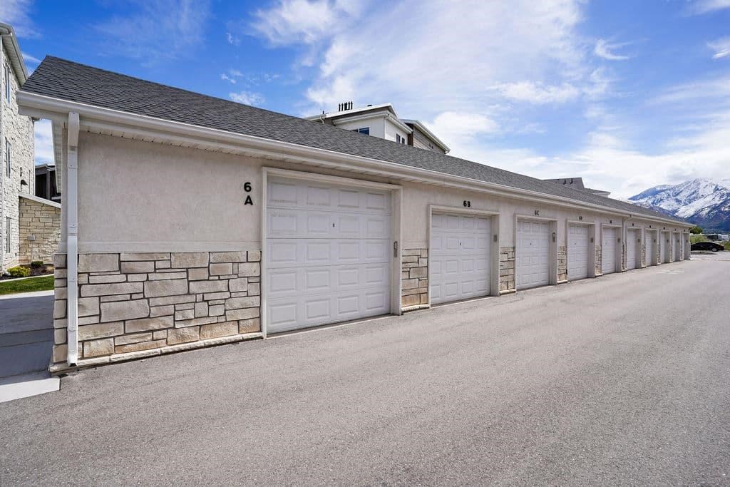 A long row of garage doors are closed.