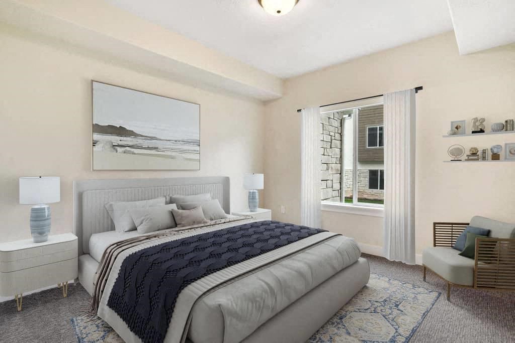 A bedroom with a large bed and a painting on the wall.