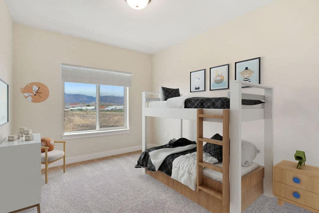 A bedroom with a bunk bed and a chair.