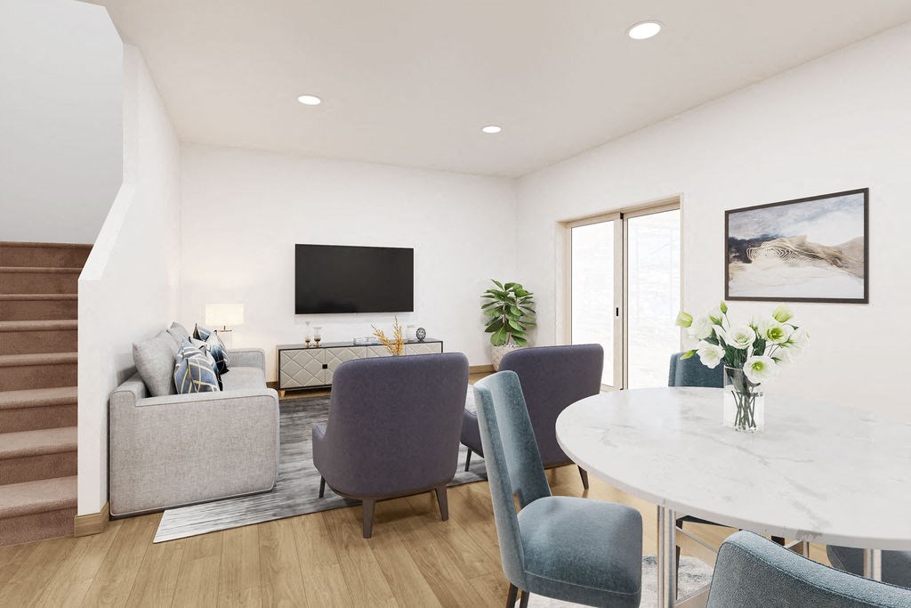 a digital rendition of a living room and dining table at Valo on Vine townhomes in Toole, UT